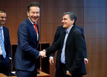 Eurogrupės vadovas Jeroenas Dijsselbloemas ir Graikijos finansų ministras Euclidas Tsakalotos